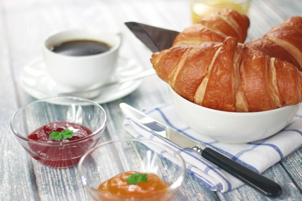 Croissant with jam and coffee